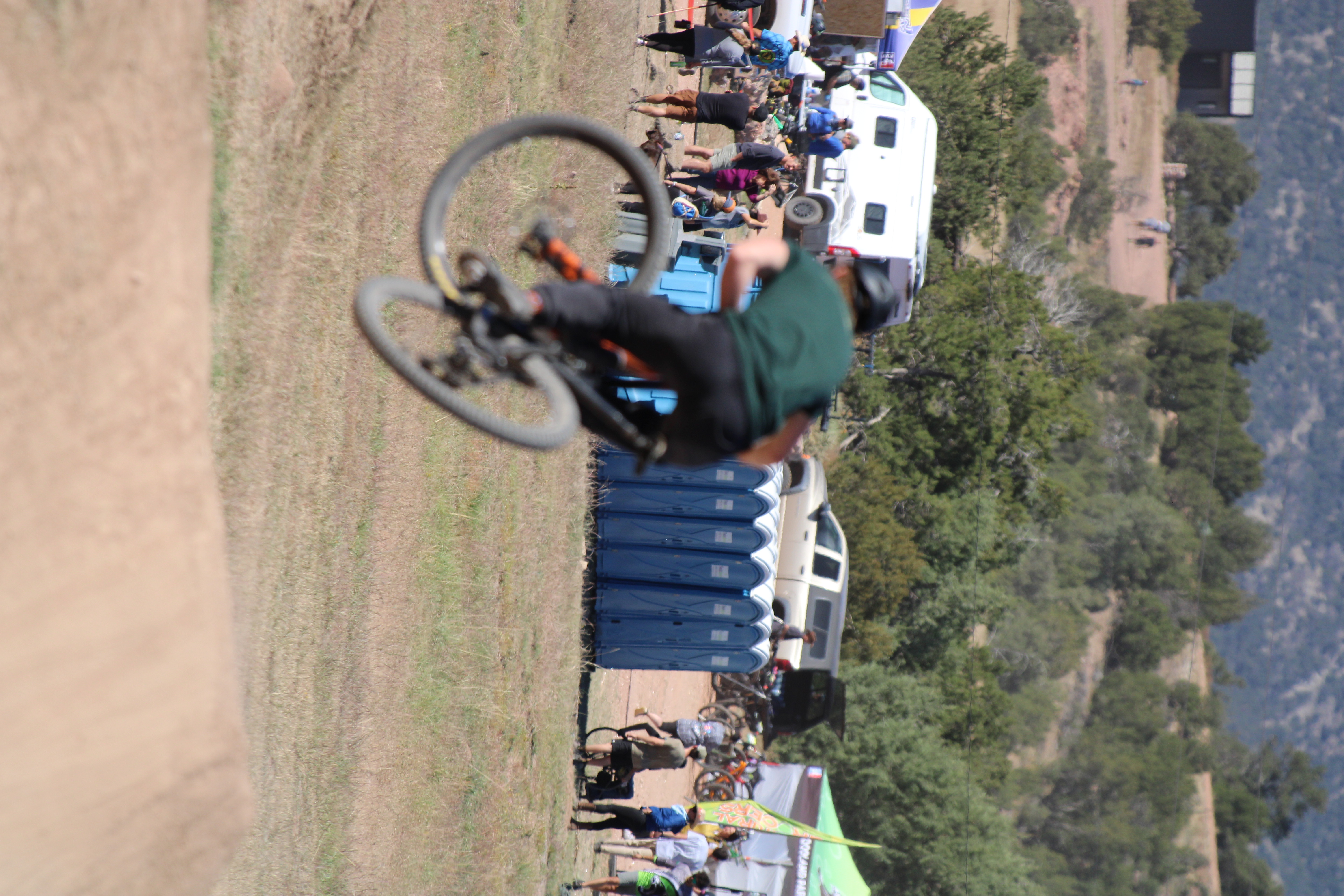 Holden dropping into a rocky trail feature