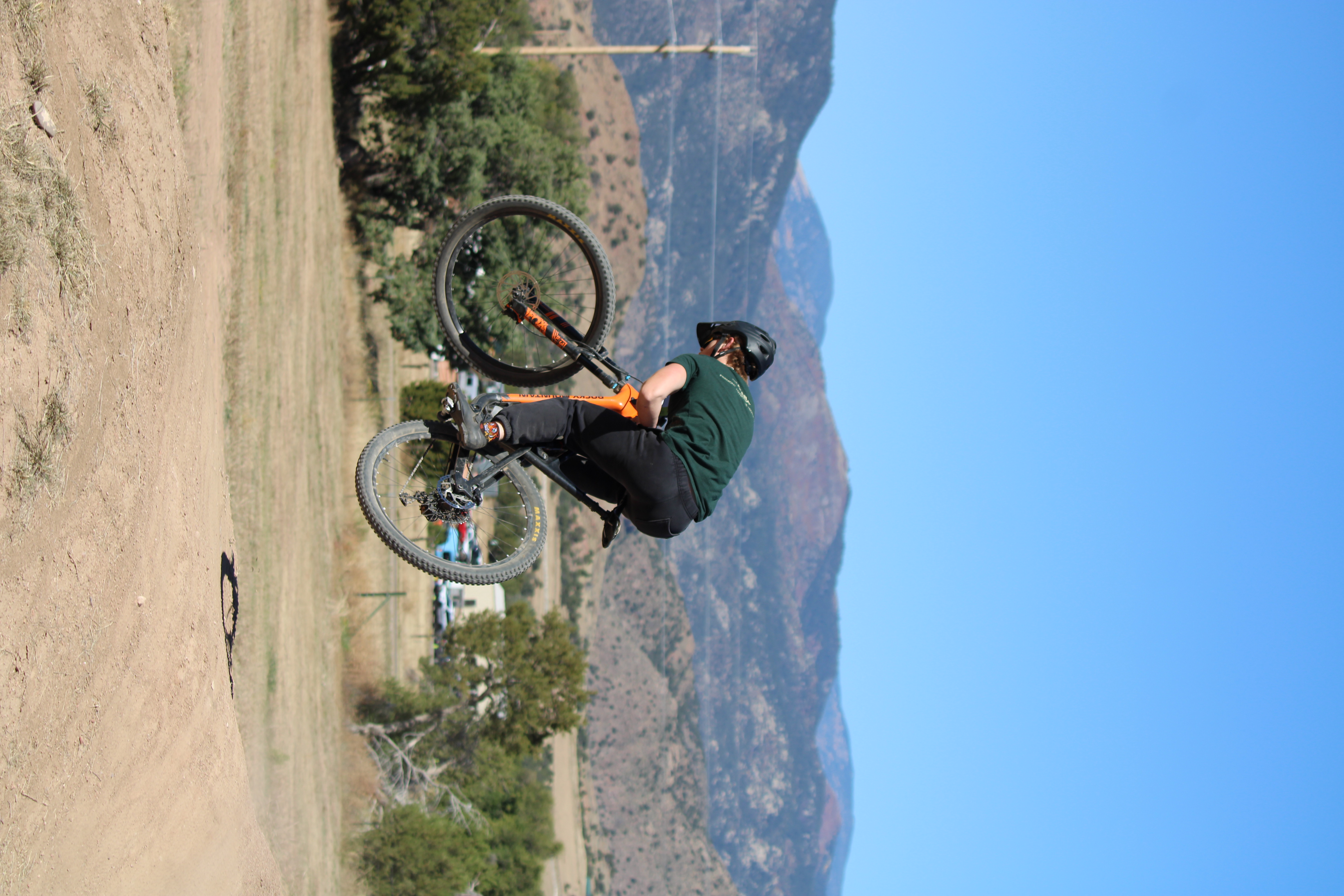 Holden riding along an alpine trail